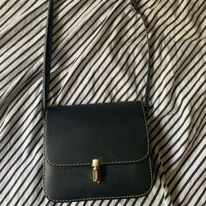 Small black purse with white stitching